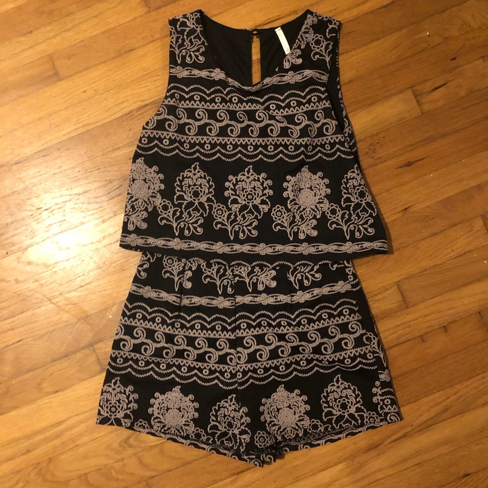 Gorgeous black romper with textured embroidery
